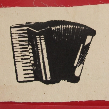 black accordion on white patch